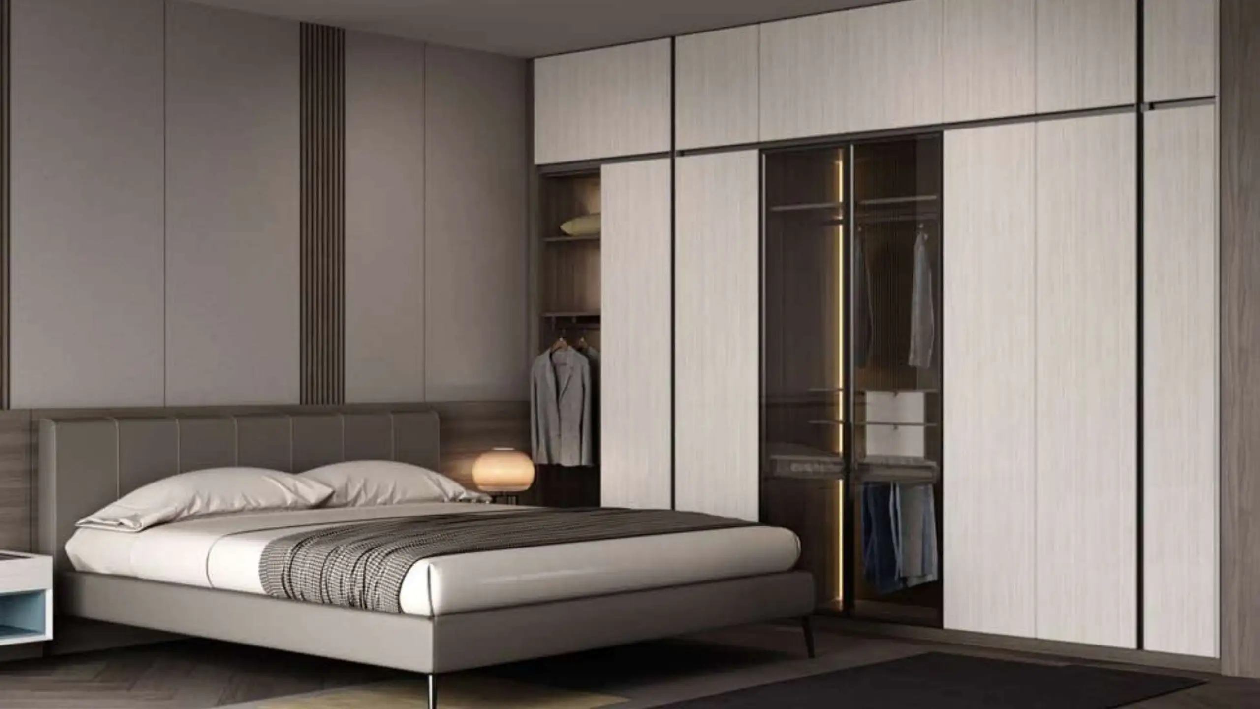Chambre, armoires blanches et tête de lit.